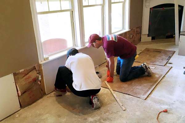 Damaged in flood, coworkers pitch in to help repair Garver engineer's home